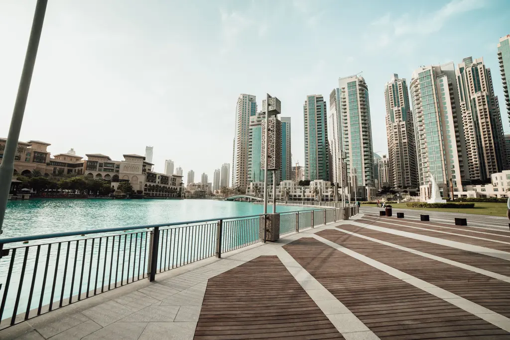 Downtown Dubai seen along a quiet waterfront promenade