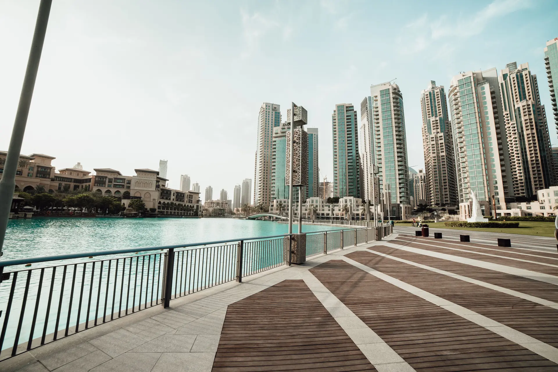 Downtown Dubai seen along a quiet waterfront promenade