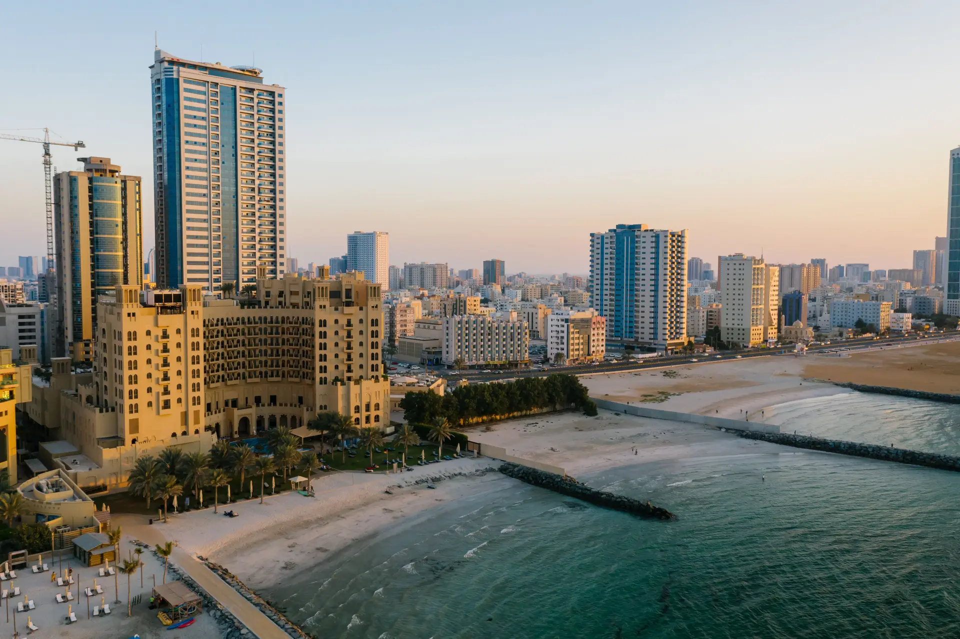 Ajman's coastline photographed from the air at sunset.